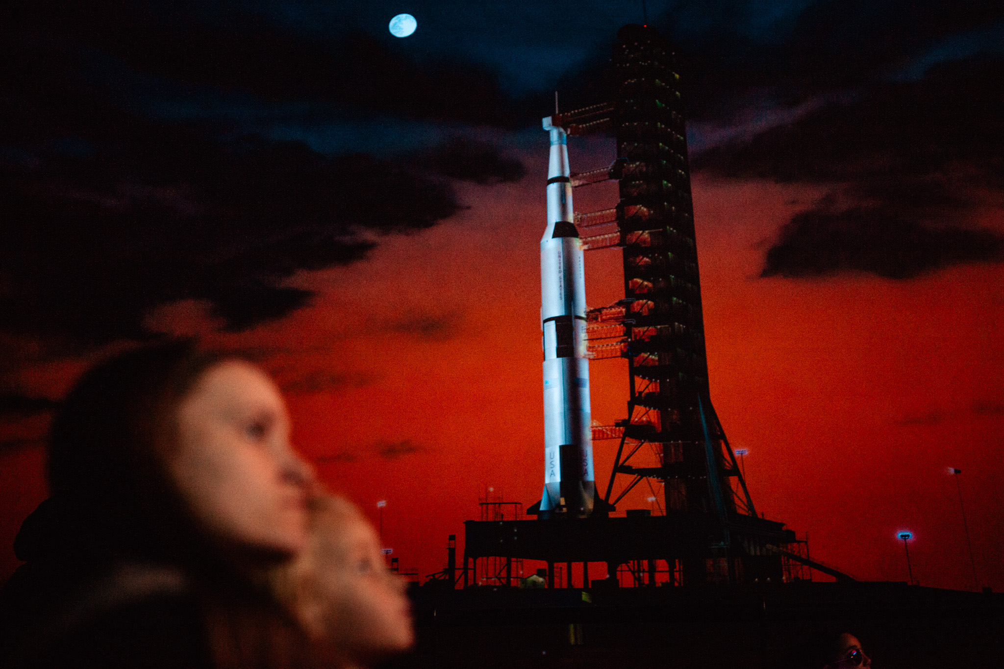 mother and daughter watch movie at kennedy space center