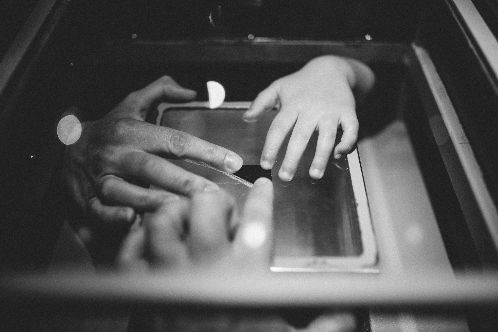 family touches moon rock