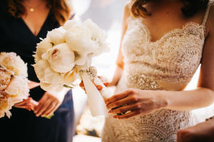 bride holds bouquet at Boston elopement